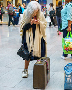 Woman at the Train Station by Dede Hartung